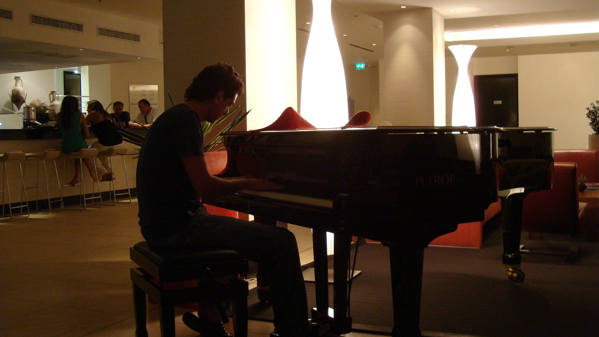 Daniel, piano teacher in Potters Bar, playing a grand piano